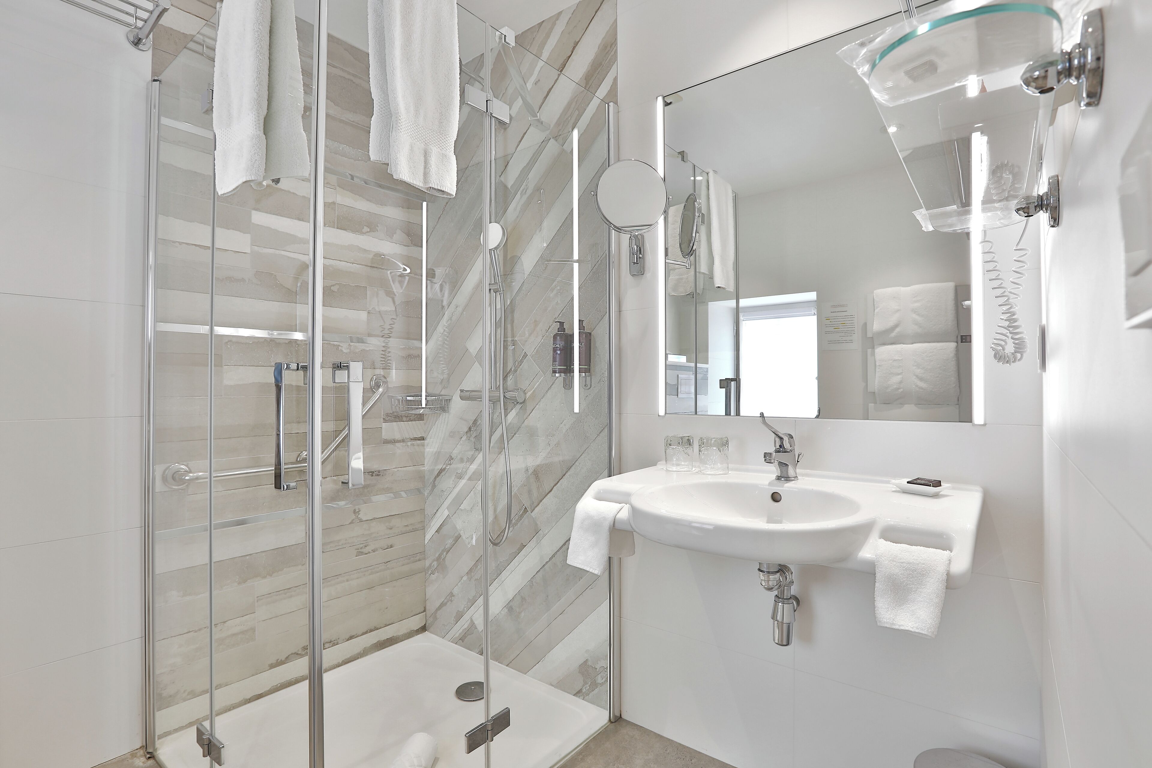 combined shower/bathtub, free toiletries, hair dryer, bathrobes