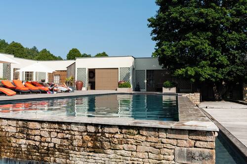 Seasonal outdoor pool, open 8:00 AM to 8:00 PM, pool umbrellas