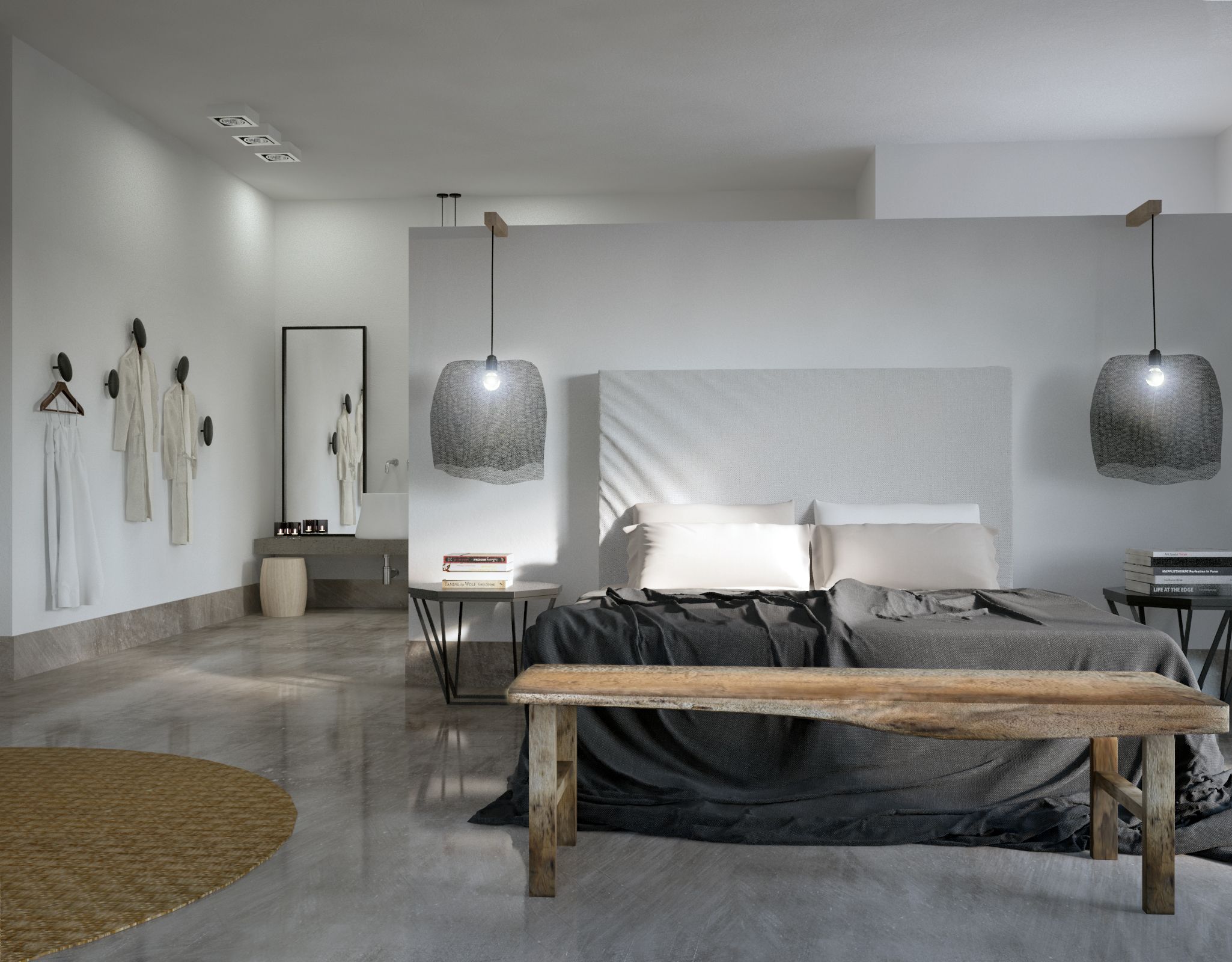 Une chambre moderne avec un grand lit, deux lampes suspendues, un banc et une petite table avec des livres.