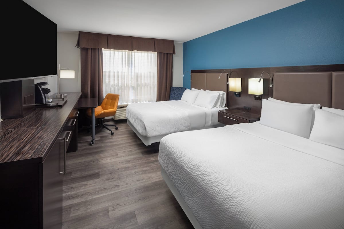 Hypo-allergenic bedding, down duvets, pillow-top beds, in-room safe