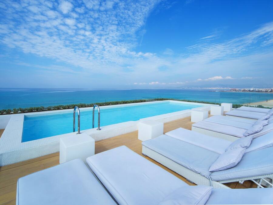 Outdoor pool, pool umbrellas, sun loungers