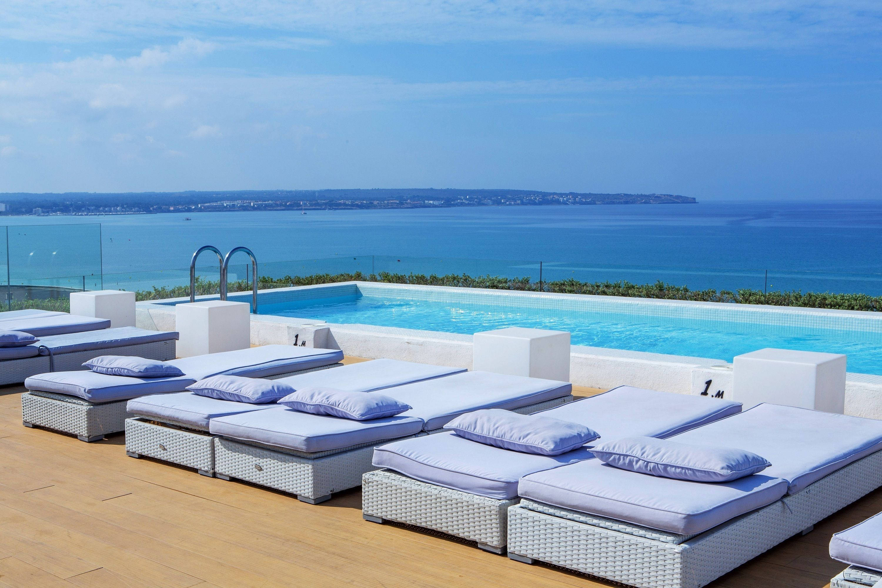 outdoor pool, pool umbrellas, pool loungers