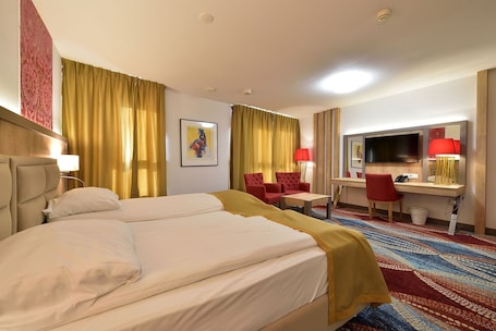 Minibar, in-room safe, desk, laptop workspace. Art Hotel Rotterdam