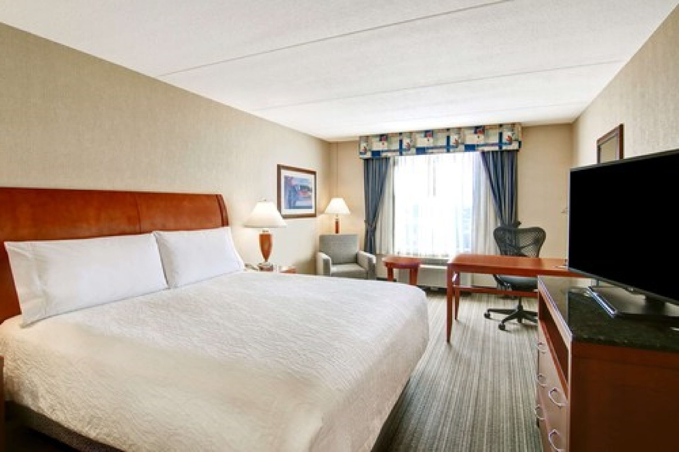 premium bedding, pillow-top beds, desk, blackout curtains