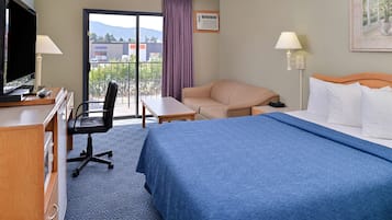 Premium bedding, desk, laptop workspace, blackout curtains