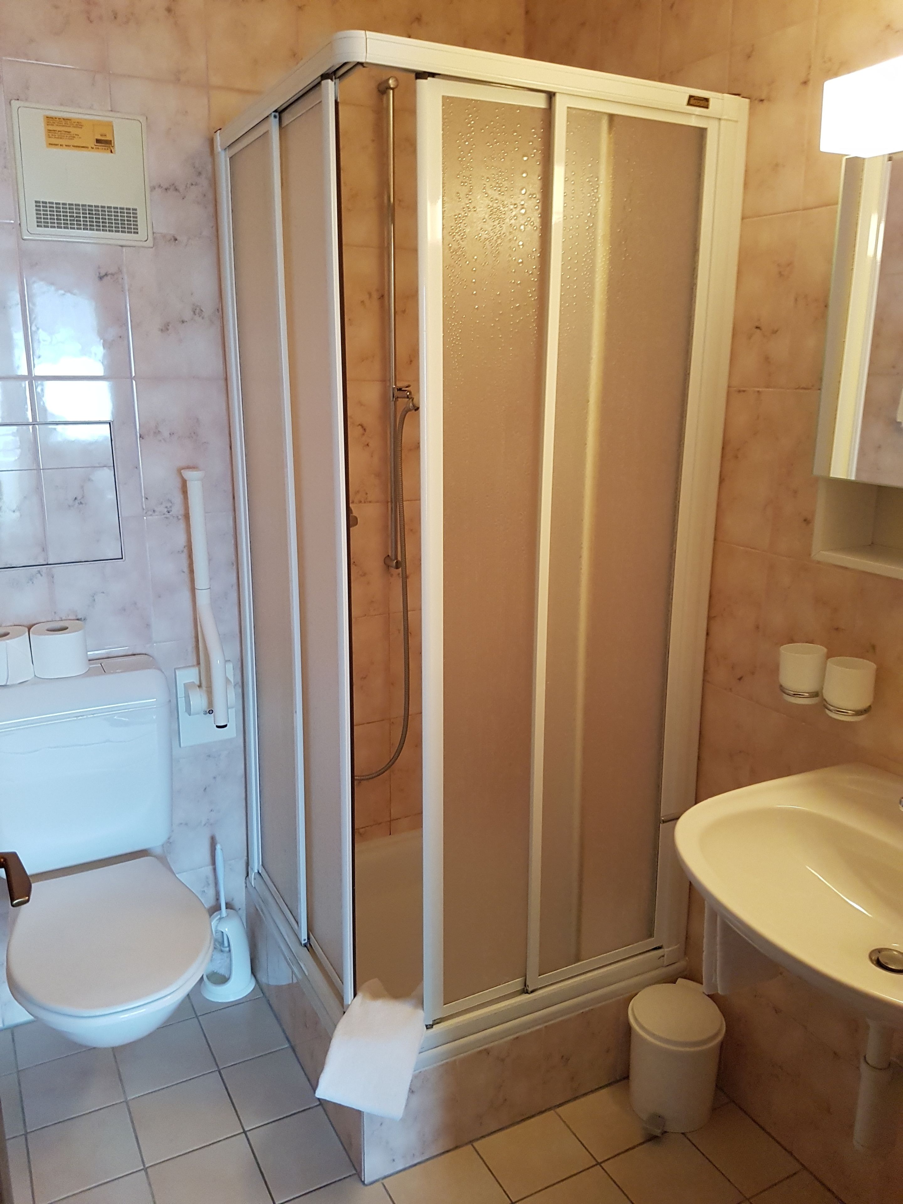 shower, rainfall showerhead, hair dryer, towels