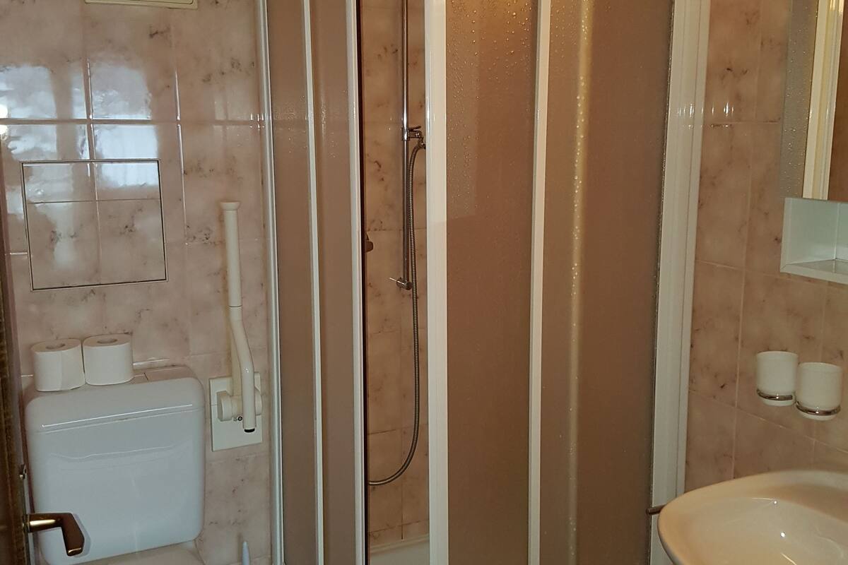 family room | 1 bedroom, minibar, in-room safe, desk