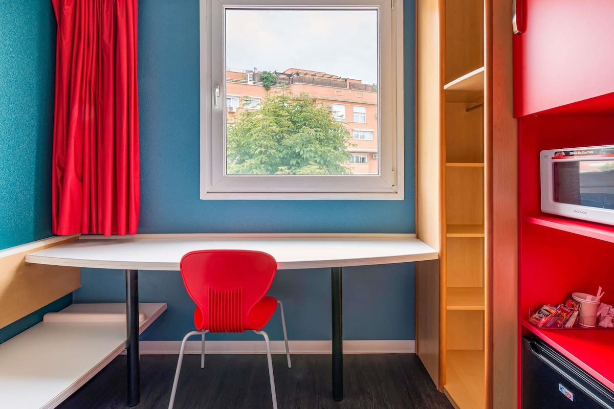 Desk, blackout drapes, soundproofing, iron/ironing board