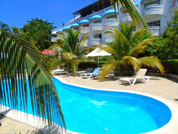 2 outdoor pools, open 8:00 AM to 10:30 PM, pool loungers