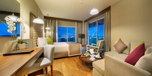 A hotel room with a bed, a sofa, a desk, and a TV. - Papillon Ayscha (Serik)