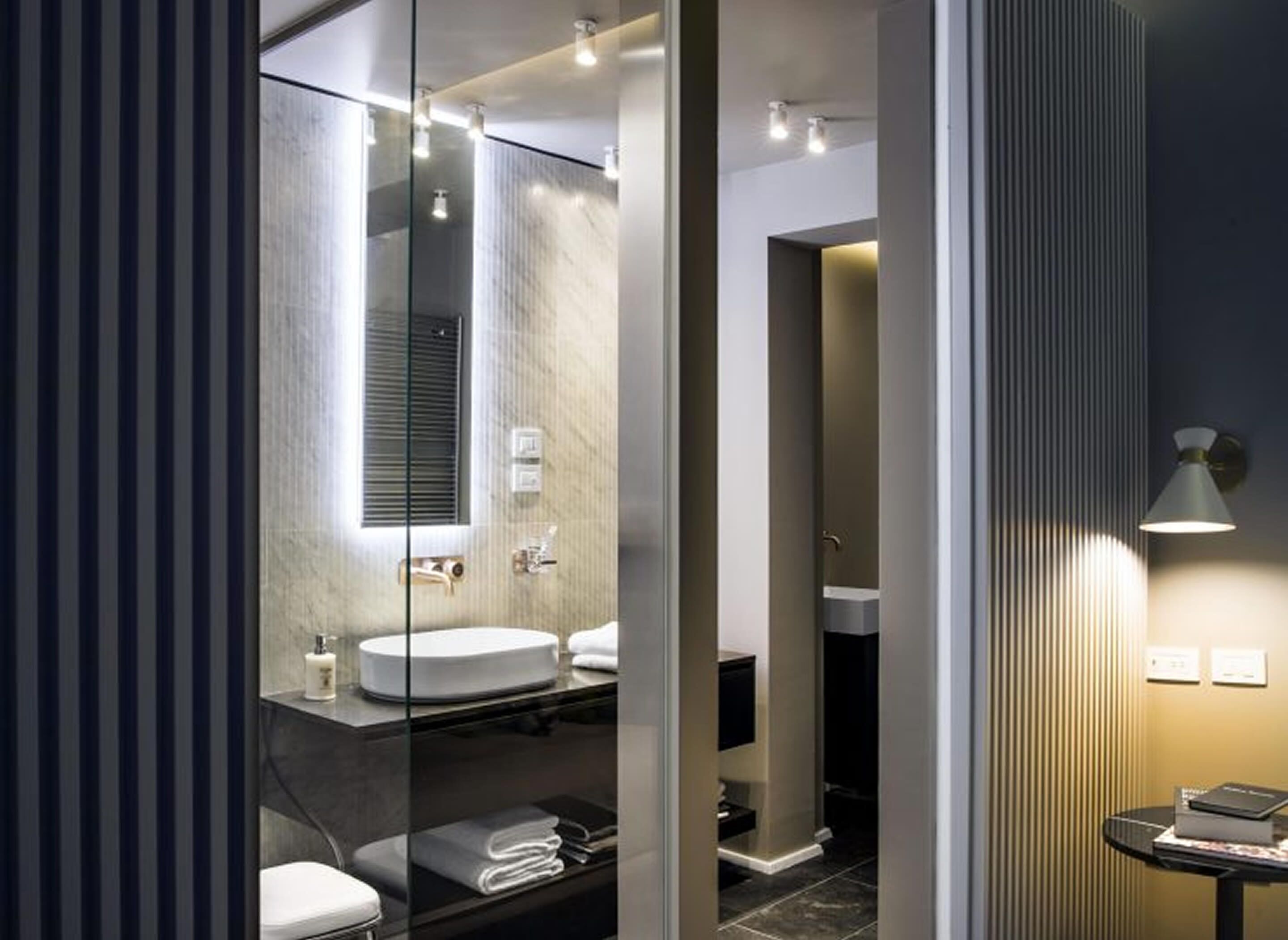 deluxe suite | bathroom | separate bathtub and shower, deep-soaking bathtub, hair dryer, slippers