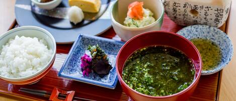 A traditional Japanese meal with various dishes on a tray.