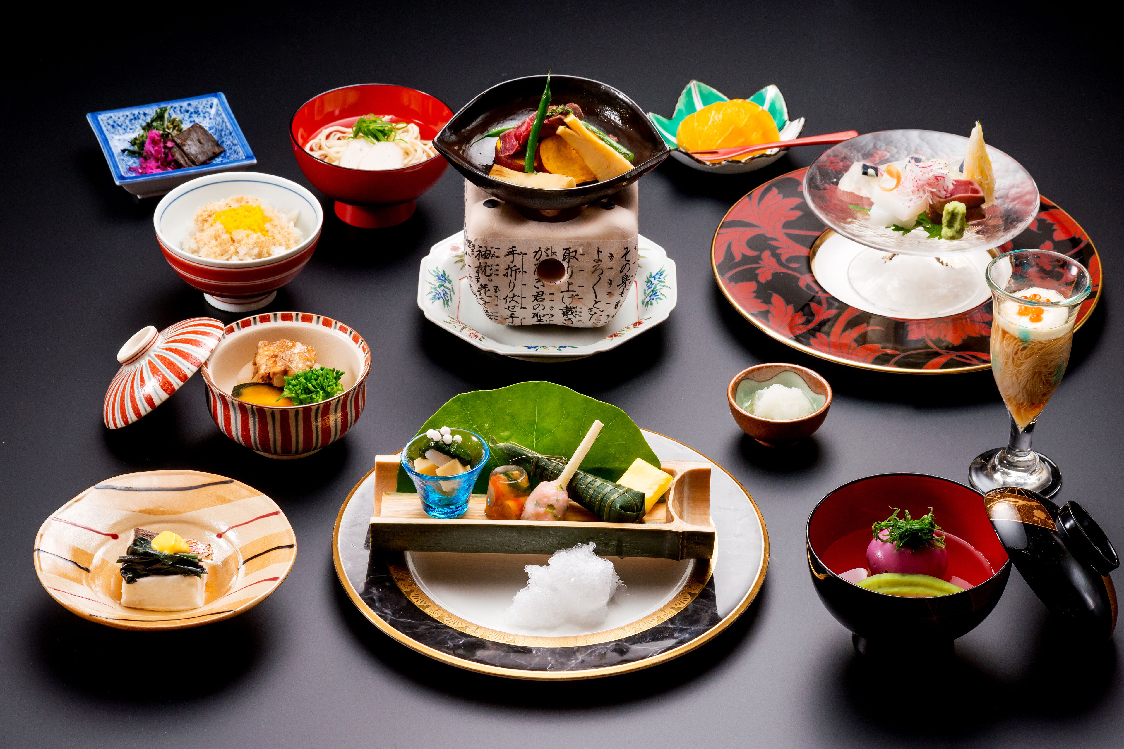 A variety of traditional Japanese dishes arranged on a table.