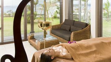 Relax in a serene spa setting with a view of the lush garden.