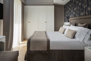 Suite familiar | Minibar, caja fuerte, escritorio y sistema de insonorización