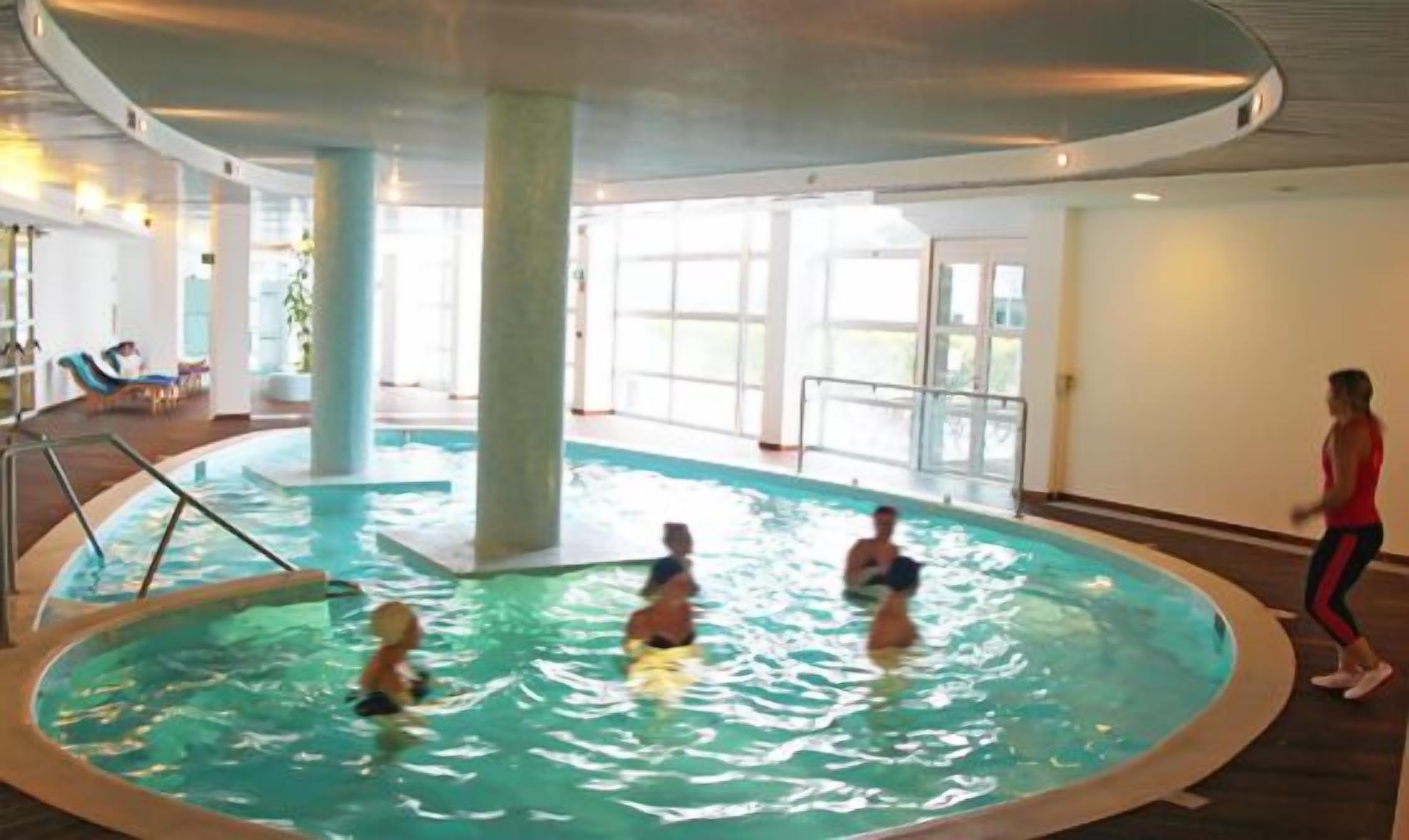 indoor pool, outdoor pool, pool umbrellas, pool loungers