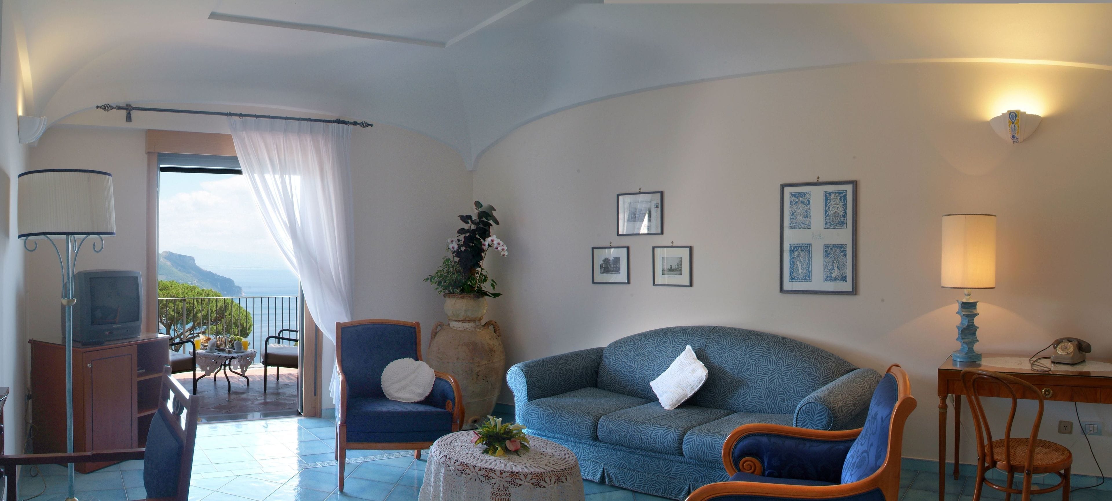 junior suite, 1 bedroom, sea view | minibar, in-room safe, desk, blackout curtains