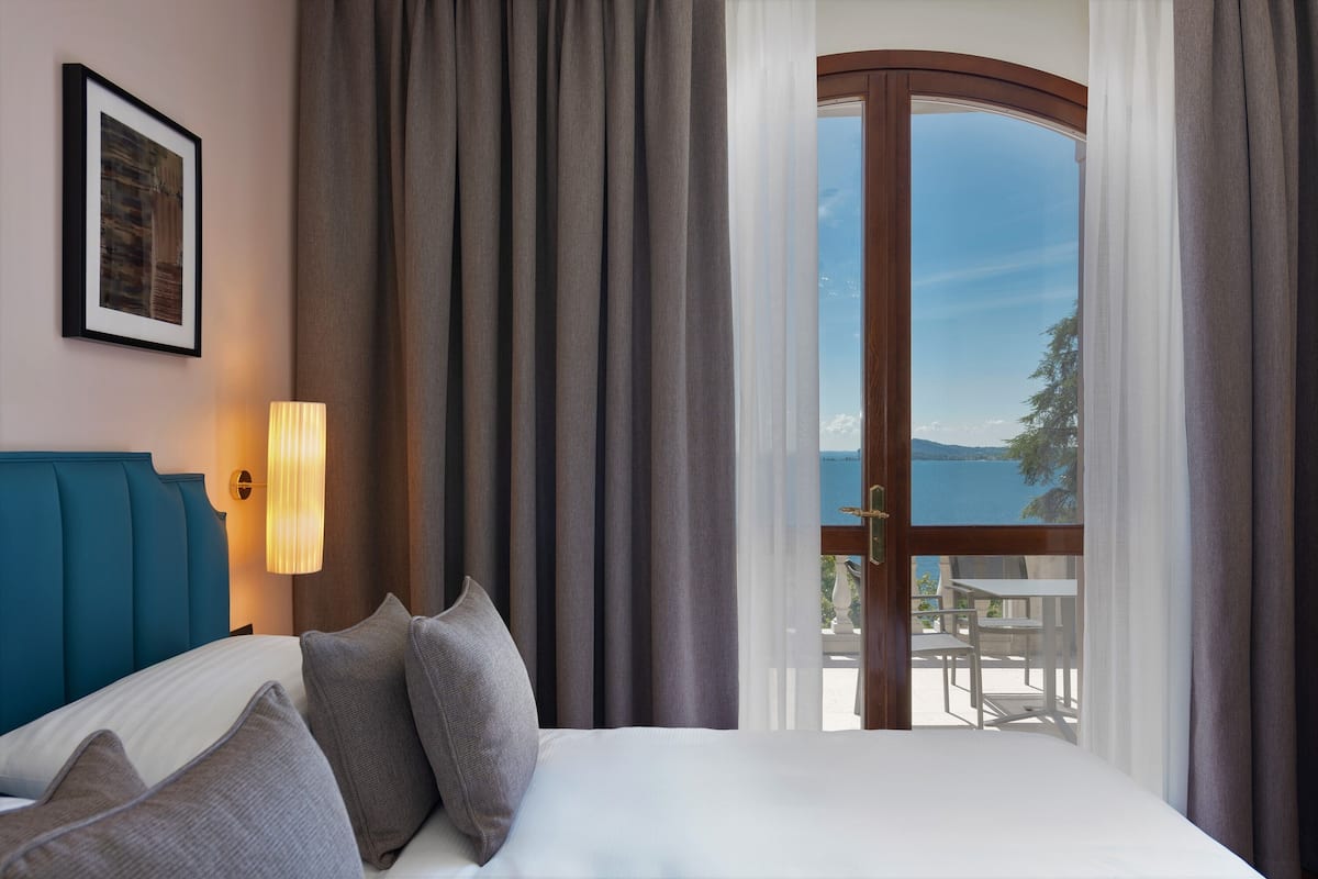 superior double room, terrace, lake view | 1 bedroom, minibar, in-room safe, desk