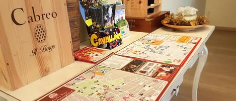 A board game setup with a map and game pieces on a table.