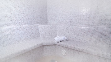 Relax in style with a unique tiled design and a comfortable bench.