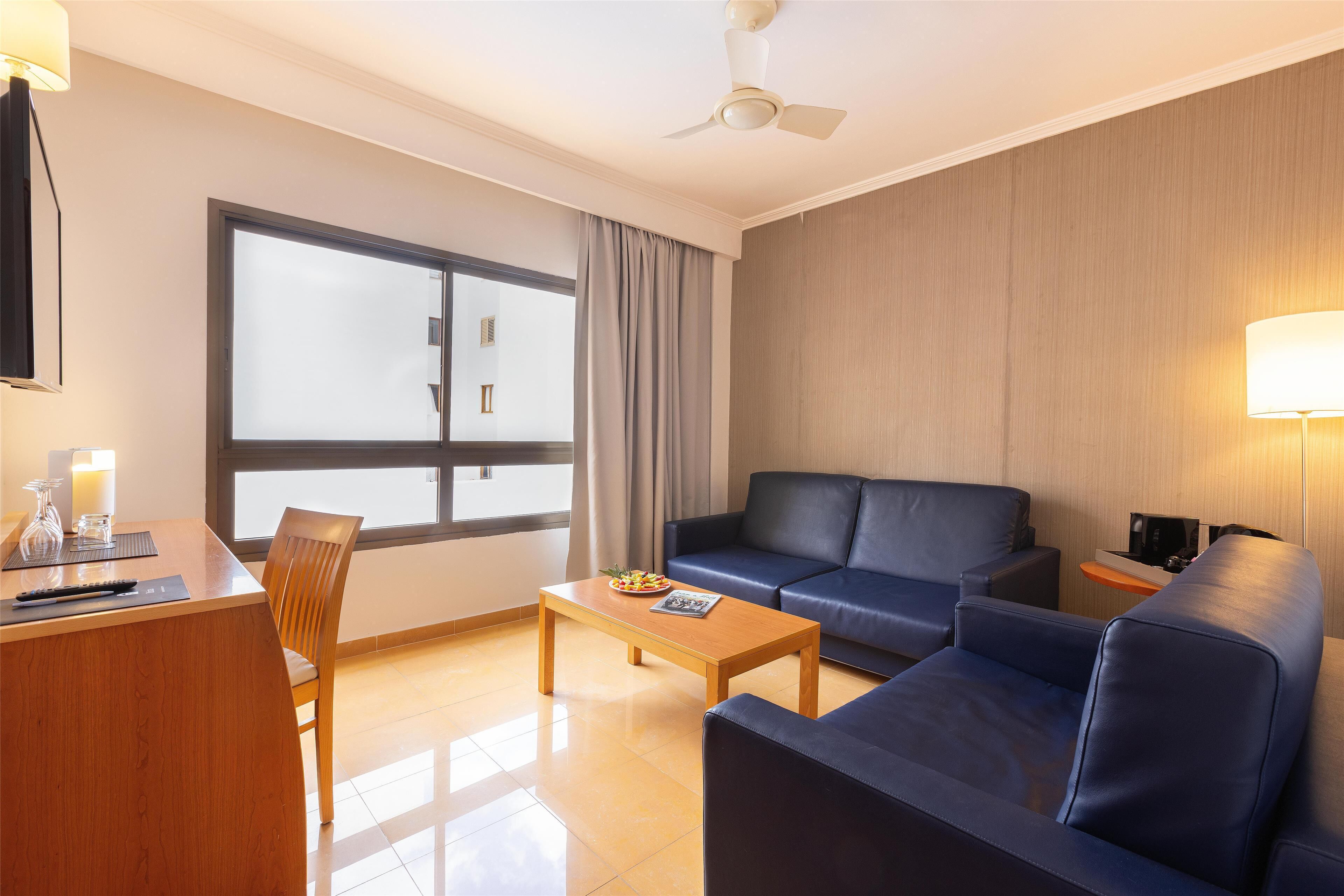 junior suite | 1 bedroom, in-room safe, individually furnished, desk
