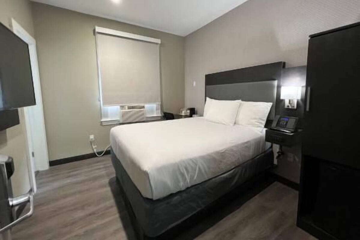 Pillowtop beds, desk, blackout drapes, iron/ironing board