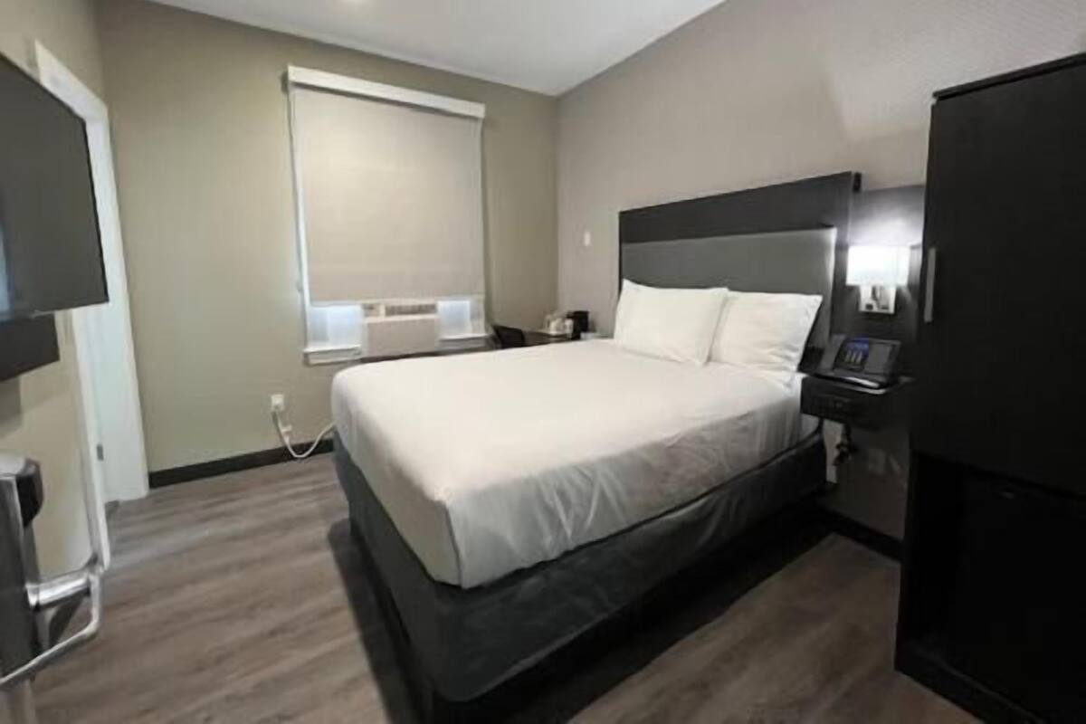 Pillowtop beds, desk, blackout drapes, iron/ironing board