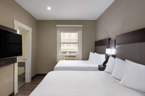 Pillowtop beds, desk, blackout drapes, iron/ironing board