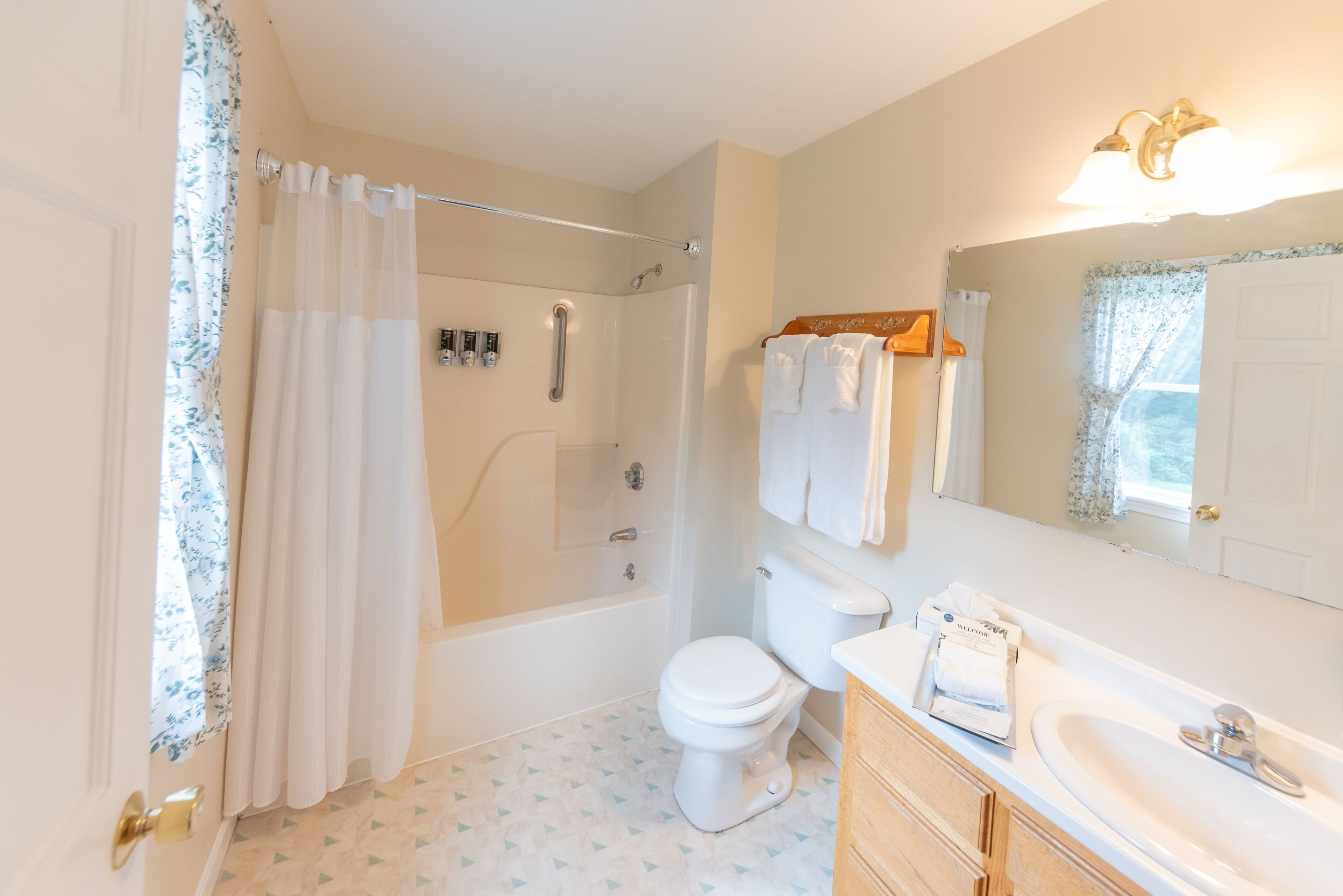 double room, 2 double beds, garden view | bathroom | combined shower/bathtub, jetted bath, hair dryer, towels