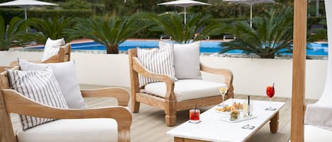 Seasonal outdoor pool, pool umbrellas, pool loungers