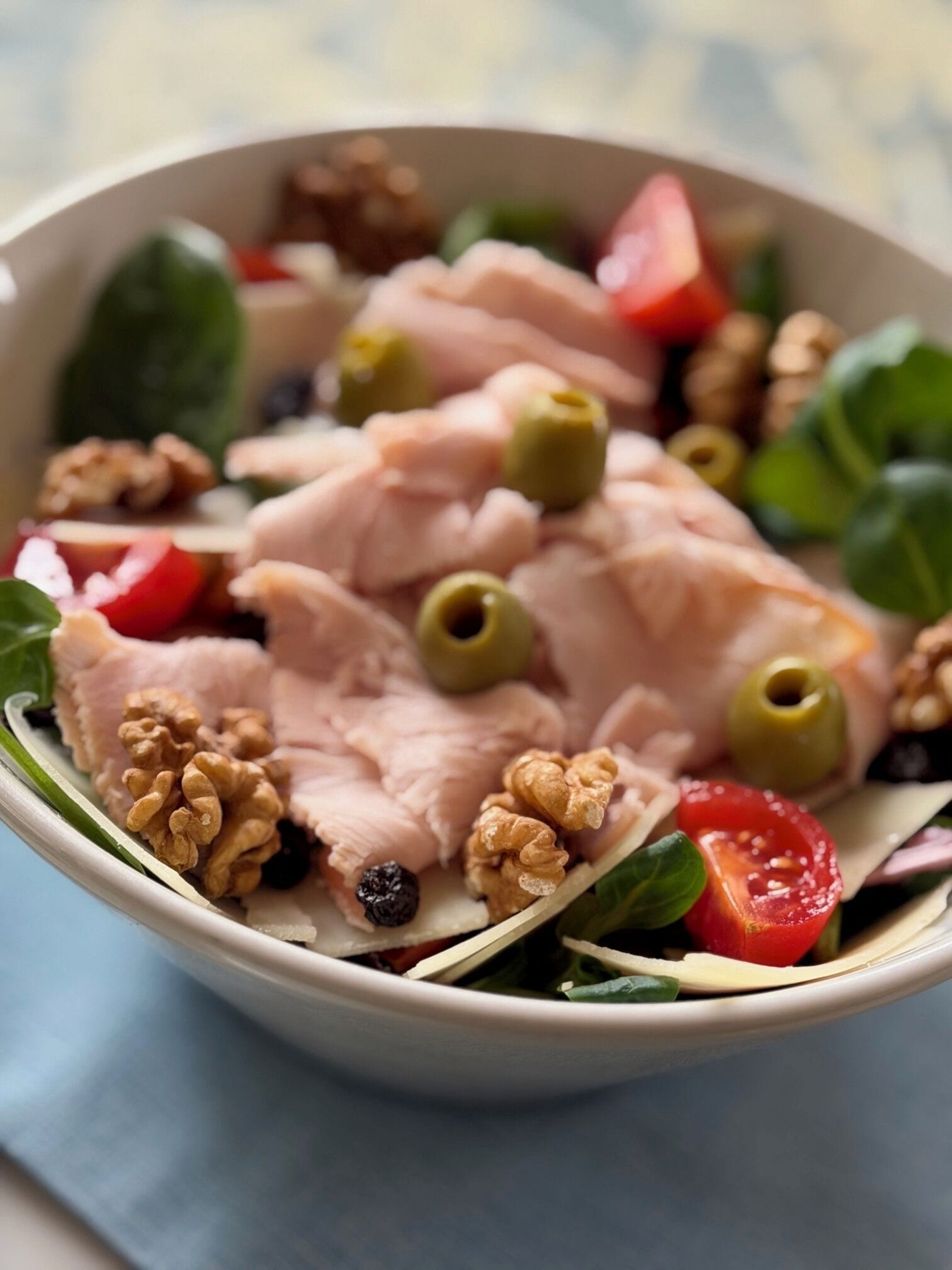A bowl of salad with various ingredients.