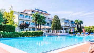 Seasonal outdoor pool, open 8:00 AM to 8:00 PM, pool umbrellas