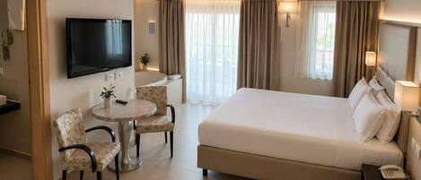 Suite, Lake View | Minibar, in-room safe, blackout drapes, iron/ironing board