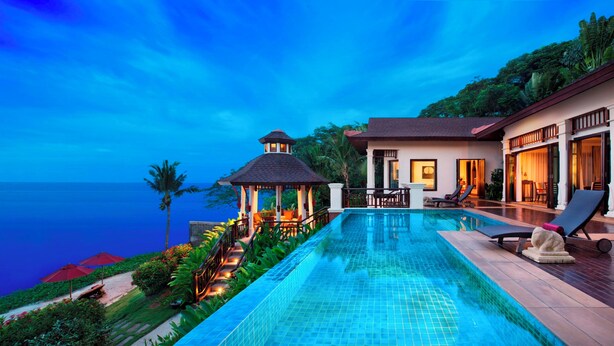 A luxurious resort with a swimming pool, a gazebo, and a view of the ocean. - InterContinental Pattaya Resort by IHG (Pattaya)