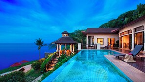 A luxurious resort with a swimming pool, a gazebo, and a view of the ocean. - InterContinental Pattaya Resort by IHG (Pattaya)