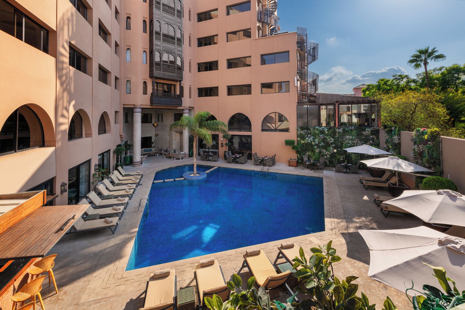 Outdoor pool, pool umbrellas, sun loungers