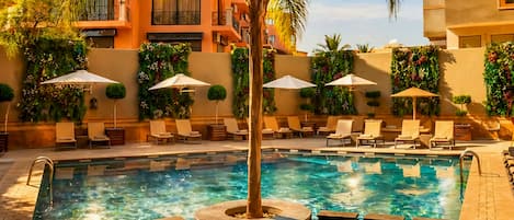 Outdoor pool, pool umbrellas, sun loungers