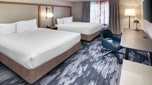 A hotel room with two beds, a desk, a chair, a TV, and a window with curtains. - Fairfield Inn and Suites by Marriott Toronto Brampton (Brampton)