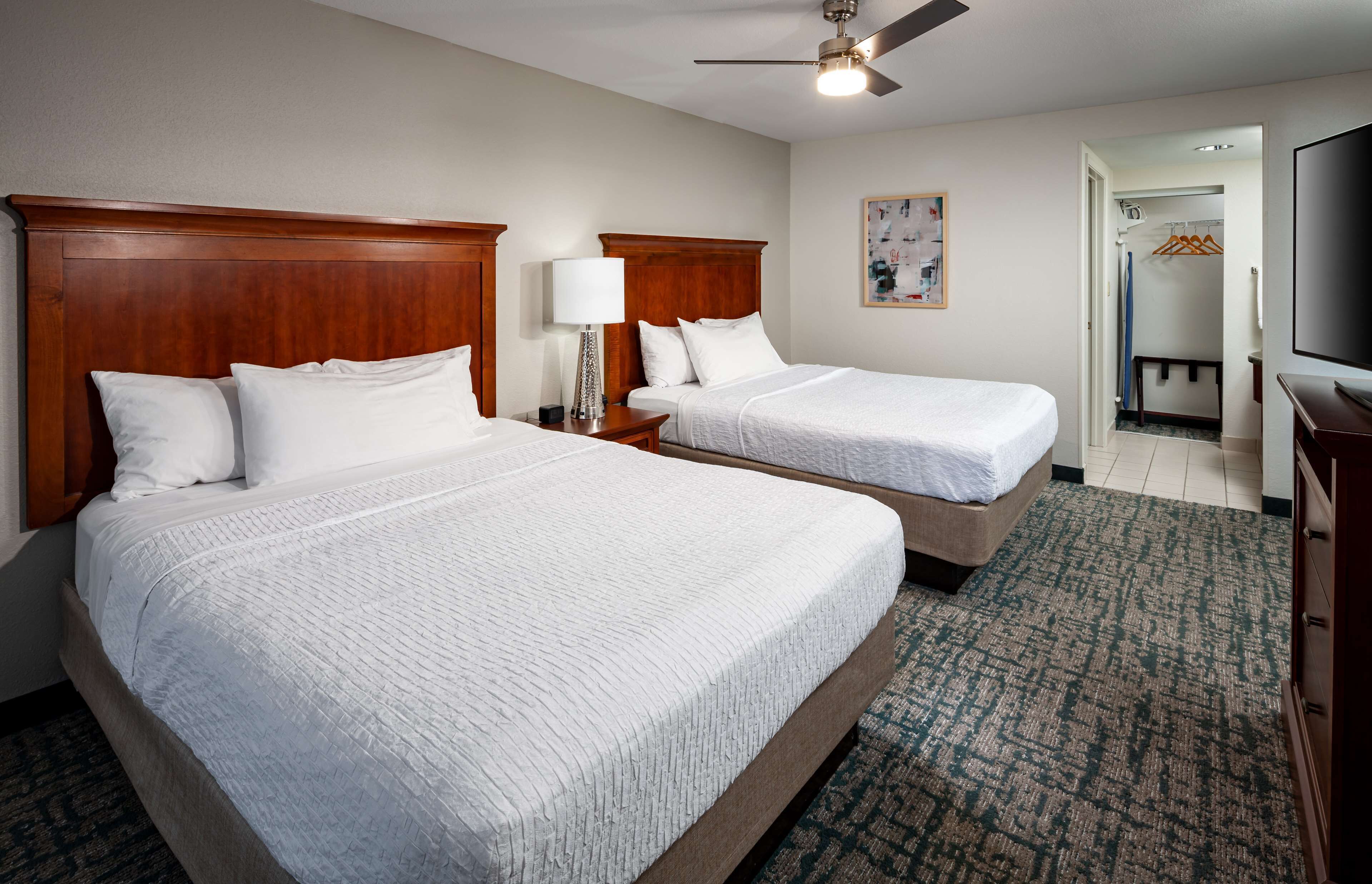 suite, 2 queen beds | in-room safe, desk, iron/ironing board, free cots/infant beds