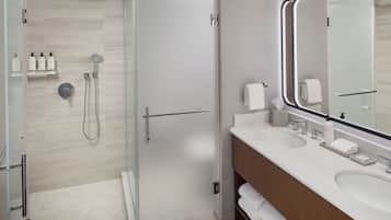 Separate tub and shower, designer toiletries, hair dryer, bathrobes