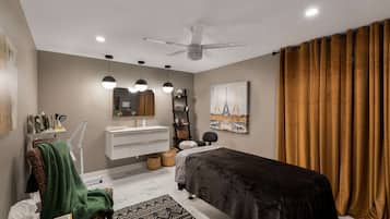 Relax in this serene bedroom with a comfortable bed, vanity, and wall-mounted shelf.