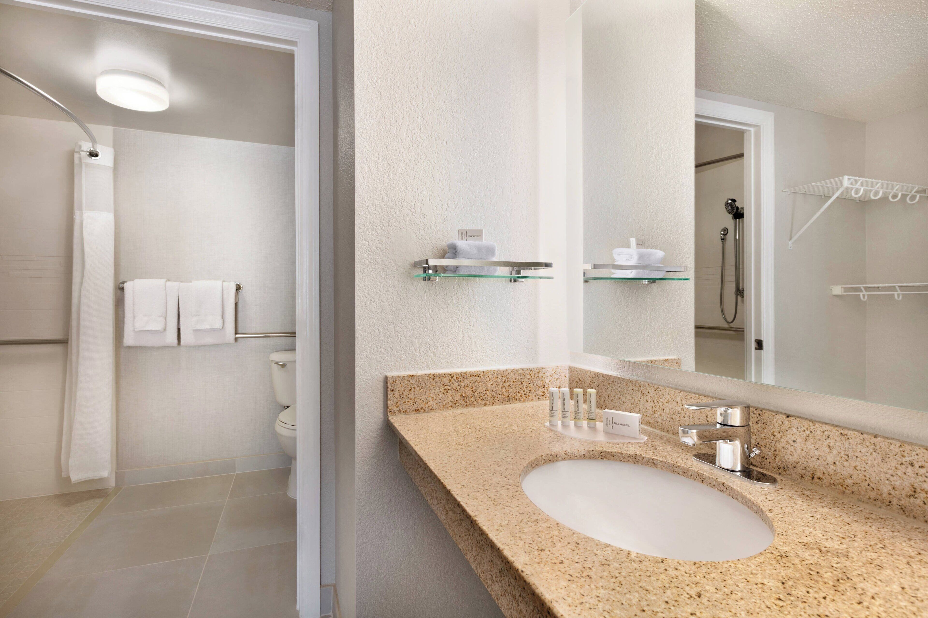 eco-friendly toiletries, hair dryer, towels, soap