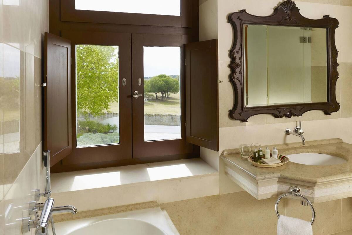 Bathroom | Separate tub and shower, rainfall showerhead, hair dryer, bathrobes