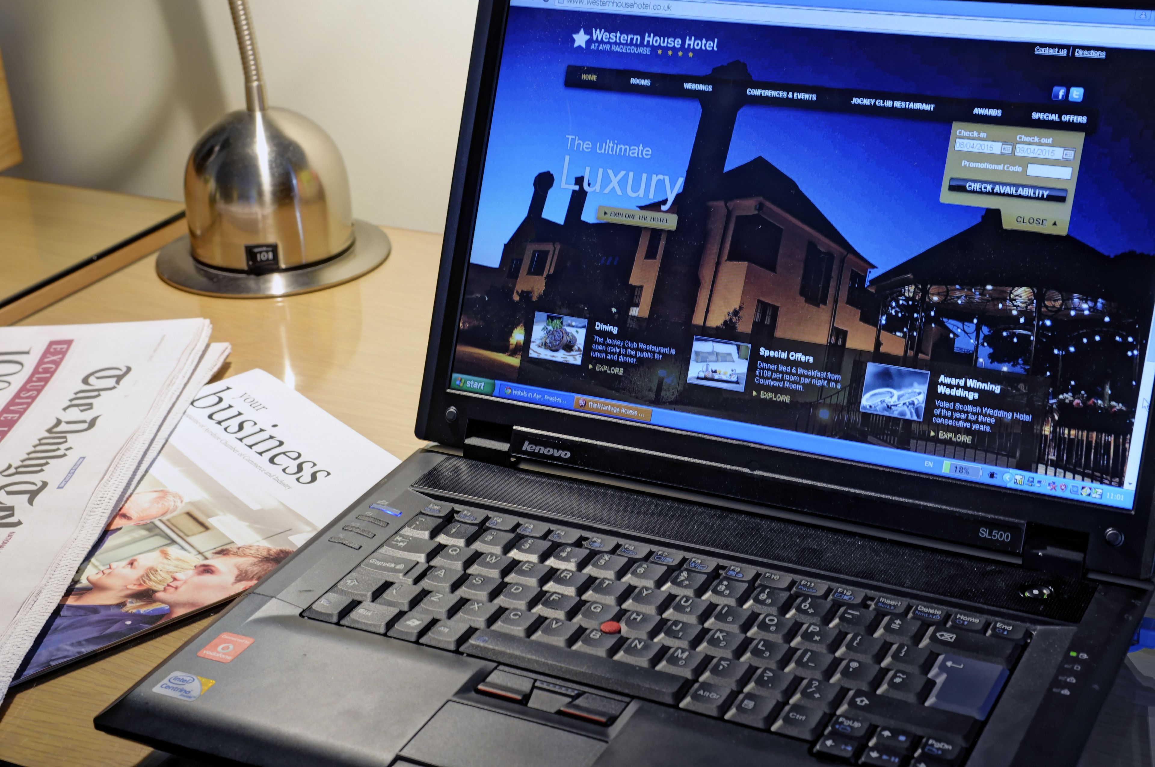 A laptop displaying a hotel website with a focus on luxury amenities.