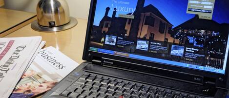A laptop displaying a hotel website with a focus on luxury amenities.