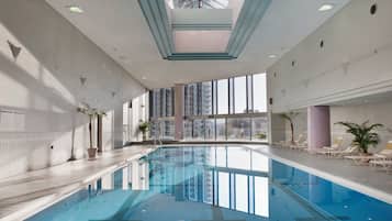 Indoor pool, open 9:00 AM to 7:00 PM, pool loungers