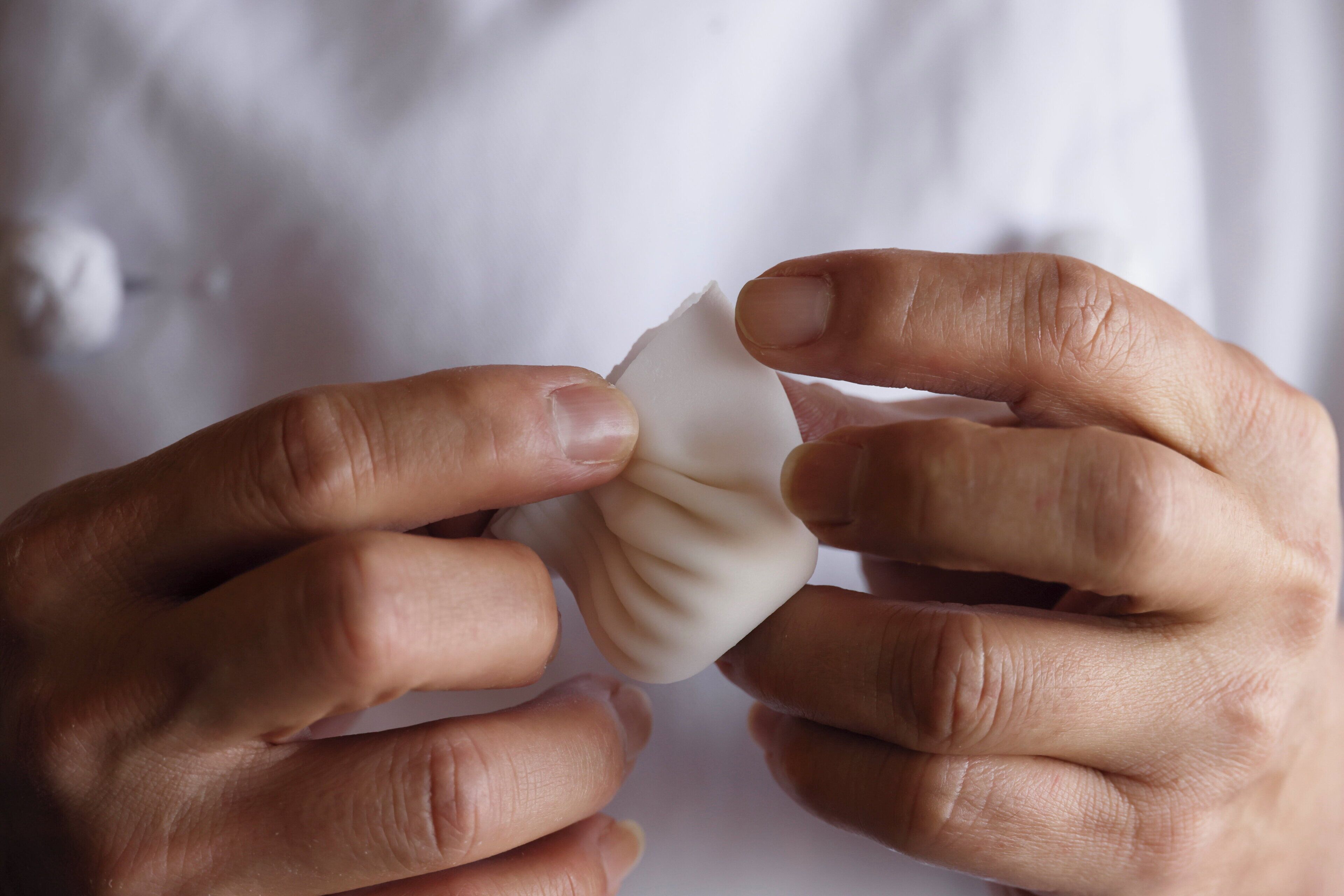 A person holding a white object.
