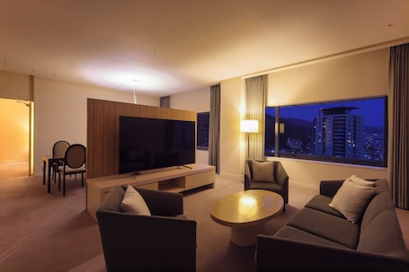 In-room safe, desk, laptop workspace, blackout drapes. ANA Crowne Plaza Kobe by IHG