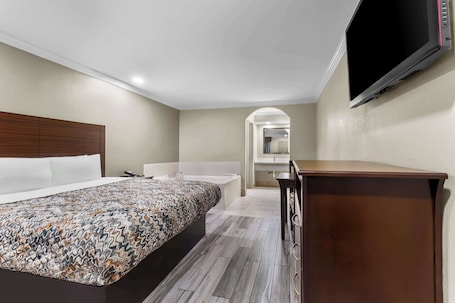 Suite, 1 King Bed, Non Smoking (Jacuzzi) | Soundproofing, iron/ironing board, free WiFi, bed sheets. Americas Best Value Inn Houston Heights at I-45