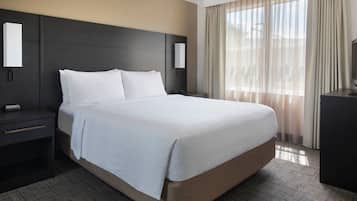 Premium bedding, desk, laptop workspace, iron/ironing board